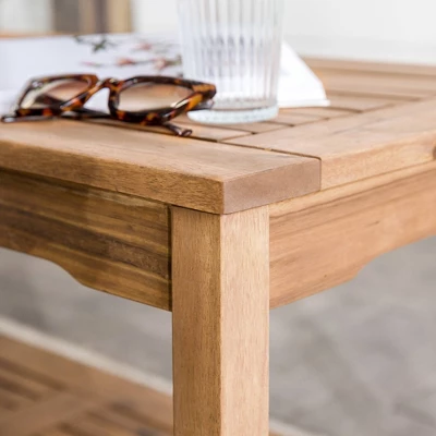 Ravenscroft Modern Boho Acacia Wood Slatted Outdoor Coffee Table With Lower Shelf - Saracina Home 6 Ravenscroft Modern Boho Acacia Wood Slatted Outdoor Coffee Table With Lower Shelf - Saracina Home - Image 6